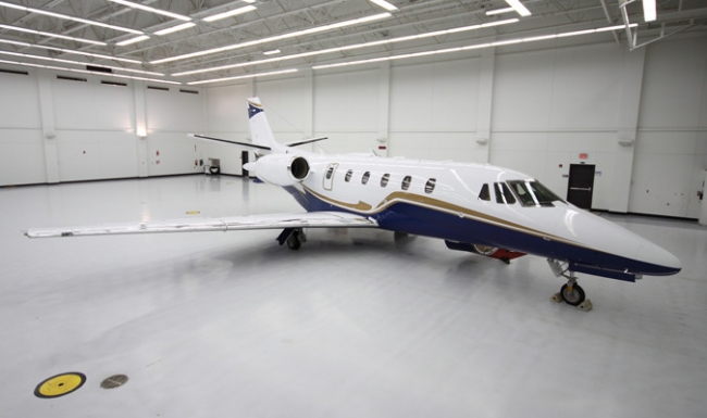 Line striping, special markings, as well as designing different colored borders can help establish maintenance parking zones for aviation hangars.